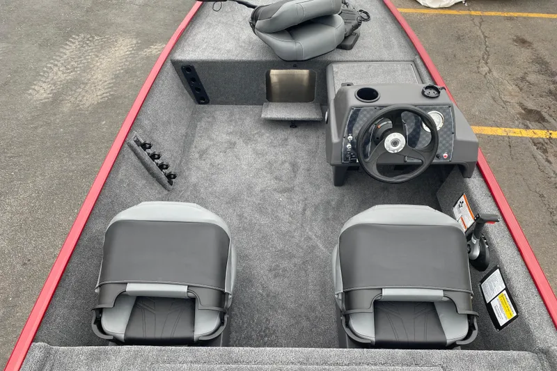 Slide: The Image of 2026 Tracker Bass Tracker Classic XL boat interior with steering wheel and seating. - 66