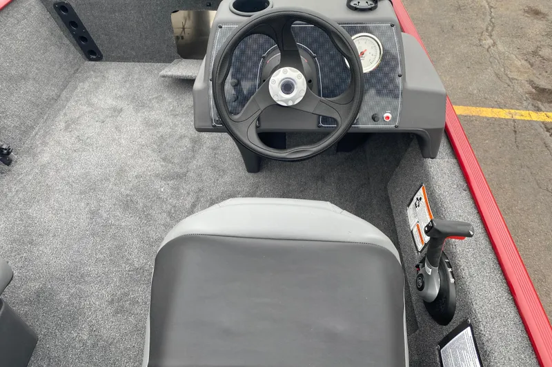 Slide: The Image of Interior of 2026 Tracker Bass Tracker Classic XL boat with steering wheel and seat. - 67