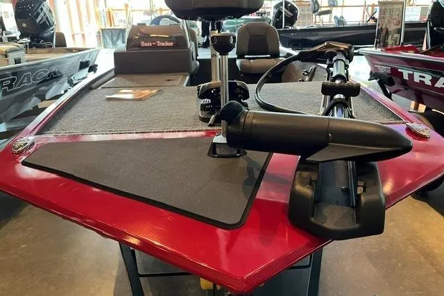 Slide: The Image of 2026 Tracker Bass Tracker Classic XL boat interior with trolling motor and seating. - 2