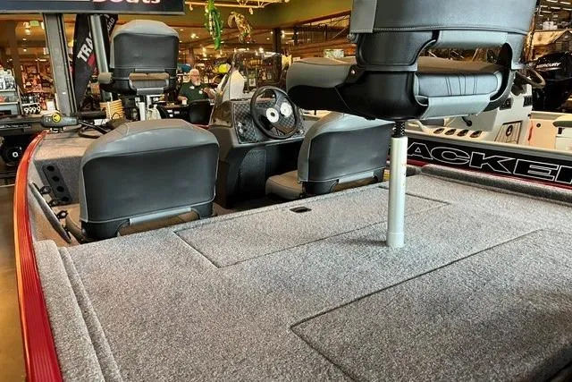 Slide: The Image of 2026 Tracker Bass Tracker Classic XL boat interior with seating and steering wheel. - 3