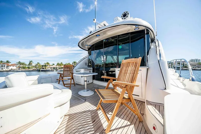 Slide: The Image of Luxurious 2012 Sea Ray 610 Sundancer yacht with spacious deck and elegant seating. - 12