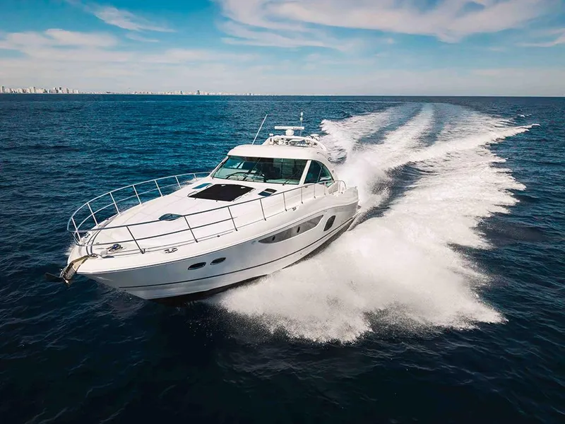 Slide: The Image of Luxury 2012 Sea Ray 610 Sundancer yacht cruising on open ocean. - 3