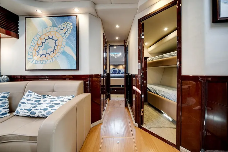 Slide: The Image of Luxurious interior of 2012 Sea Ray 610 Sundancer yacht with elegant seating and artwork. - 31