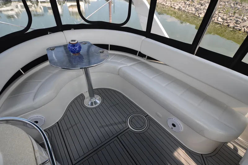 Slide: The Image of Luxurious seating area on 2004 Carver 420 Mariner yacht with elegant table and modern design. - 10
