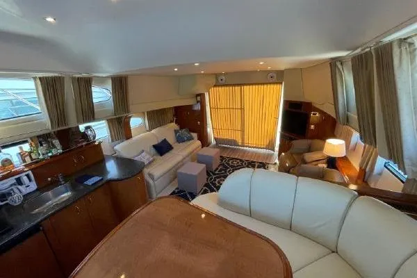 Slide: The Image of Luxurious interior of 2004 Carver 420 Mariner yacht with elegant seating and modern amenities. - 13