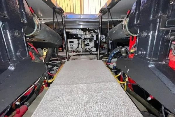 Slide: The Image of Engine room of a 2004 Carver 420 Mariner yacht, showcasing mechanical components. - 15