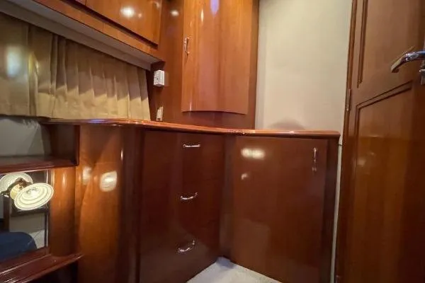 Slide: The Image of Luxurious wooden cabinetry inside a 2004 Carver 420 Mariner yacht cabin. - 18