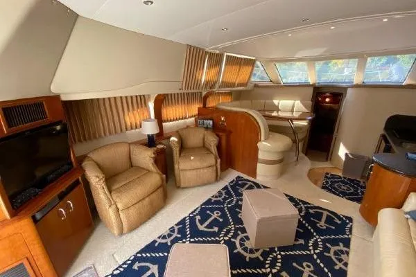 Slide: The Image of Luxurious interior of 2004 Carver 420 Mariner yacht with plush seating and nautical decor. - 22