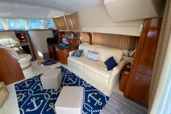 Slide: The Image of Luxurious interior of a 2004 Carver 420 Mariner yacht with elegant seating and nautical decor. - 24