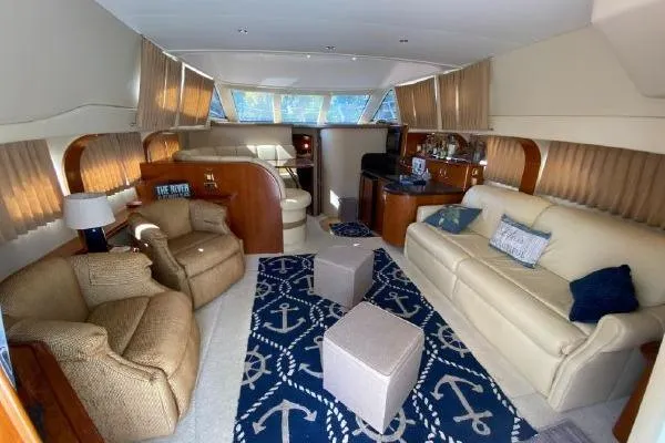 Slide: The Image of Luxurious interior of 2004 Carver 420 Mariner yacht with elegant seating and nautical decor. - 25