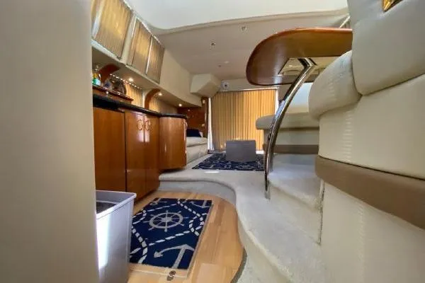 Slide: The Image of Interior of a 2004 Carver 420 Mariner yacht with luxurious seating and nautical decor. - 26