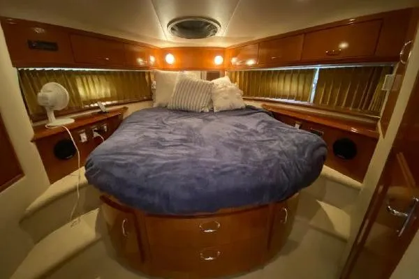 Slide: The Image of Luxurious cabin interior of 2004 Carver 420 Mariner yacht with cozy bedding. - 29