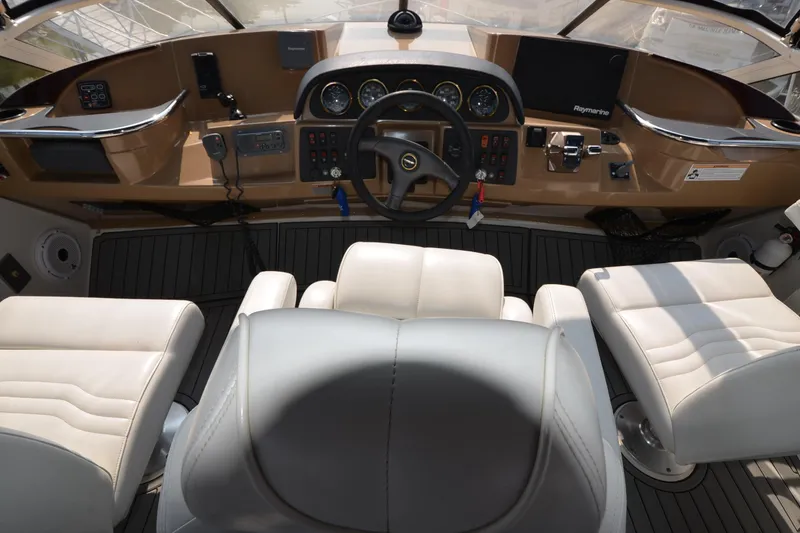 Slide: The Image of Interior helm of 2004 Carver 420 Mariner yacht with steering wheel and controls. - 8