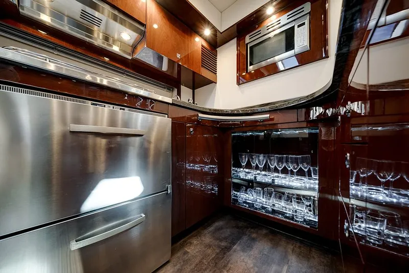 Slide: The Image of Luxurious kitchen interior of 2012 Sea Ray 610 Sundancer yacht with modern appliances. - 30
