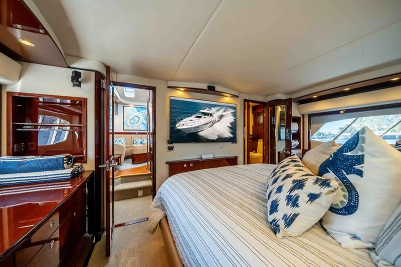 Slide: The Image of Luxurious interior of 2012 Sea Ray 610 Sundancer yacht with elegant bedroom decor. - 33
