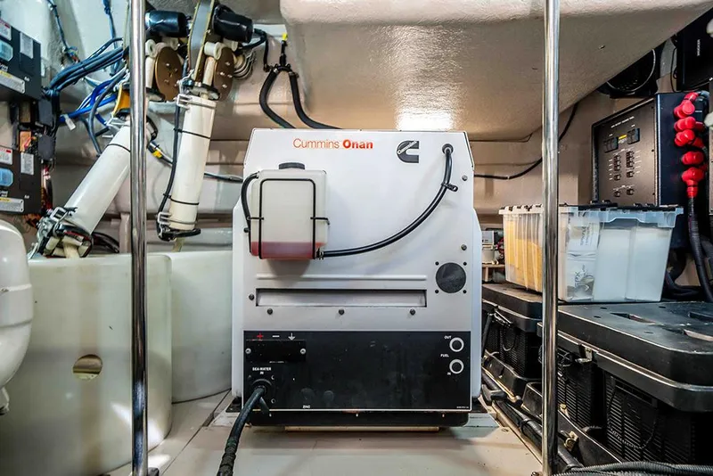 Slide: The Image of Engine room of 2012 Sea Ray 610 Sundancer with Cummins Onan generator. - 51