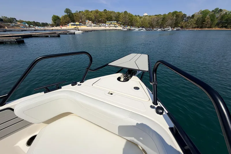 Slide: The Image of Bow view of 2027 Navan T30 boat docked on a serene lake. - 12