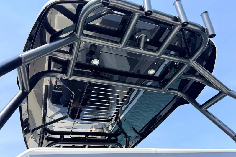 Slide: The Image of Navan T30 2027 boat canopy with sleek black design and rod holders. - 15