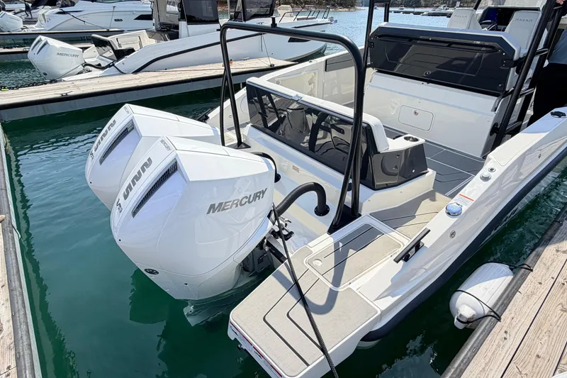 Slide: The Image of Navan T30 2027 boat with dual Mercury engines docked at marina. - 3