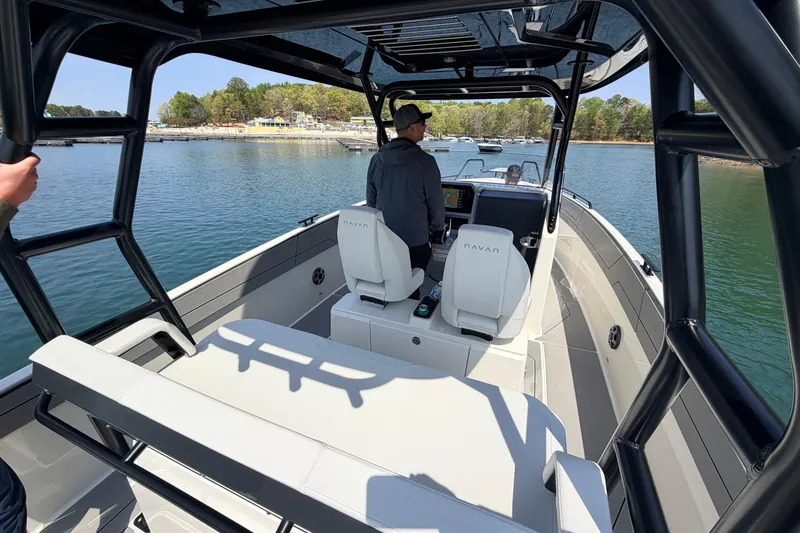 Slide: The Image of 2027 Navan T30 boat on water, featuring modern design and spacious seating. - 7