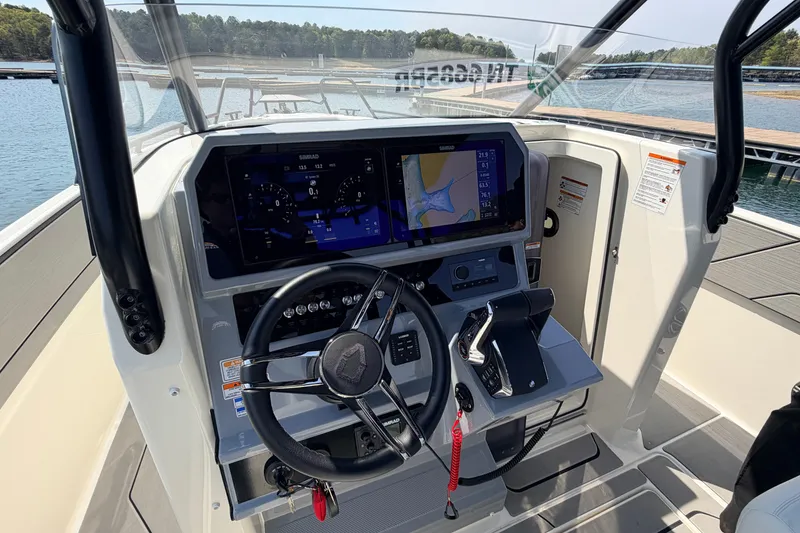 Slide: The Image of Helm of 2027 Navan T30 boat with advanced navigation system and steering wheel. - 9