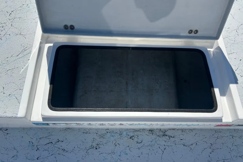 Slide: The Image of Open storage compartment on 2021 Shallow Stalker CAT-204 Pro boat. - 10