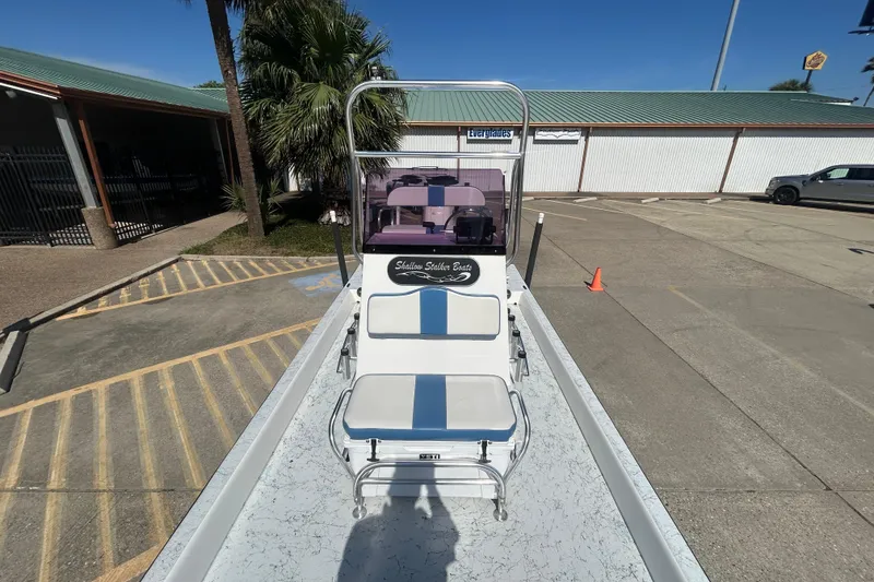 Slide: The Image of 2021 Shallow Stalker CAT-204 Pro boat parked outdoors, showcasing seating and console. - 11