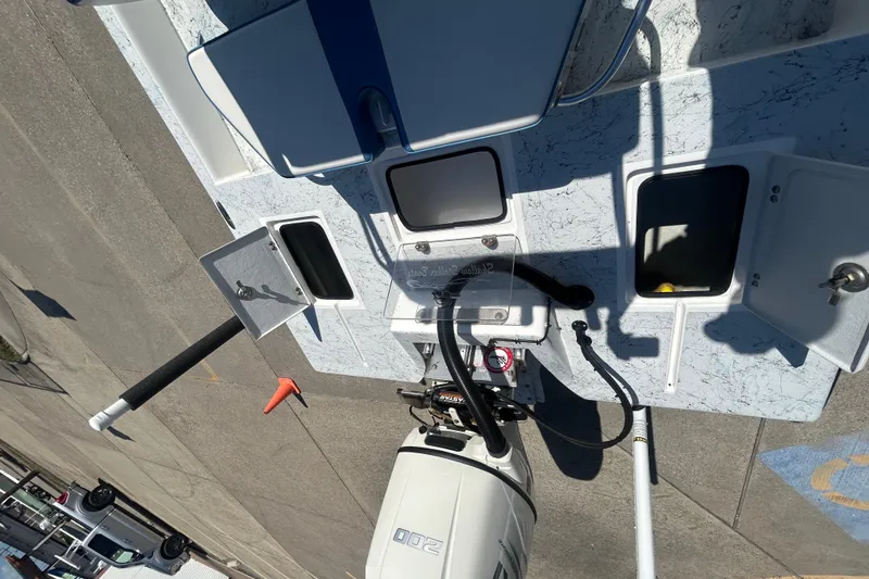 Slide: The Image of 2021 Shallow Stalker CAT-204 Pro boat deck with storage compartments and motor. - 12