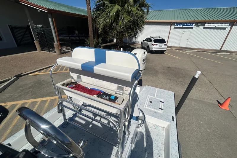 Slide: The Image of 2021 Shallow Stalker CAT-204 Pro boat parked outside a building with palm trees. - 5