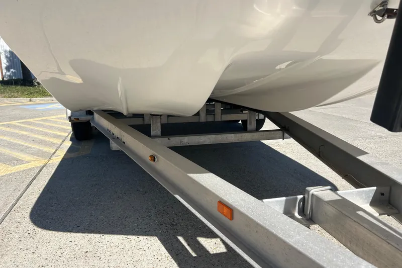 Slide: The Image of Shallow Stalker CAT-204 Pro 2021 boat on trailer, close-up view. - 6