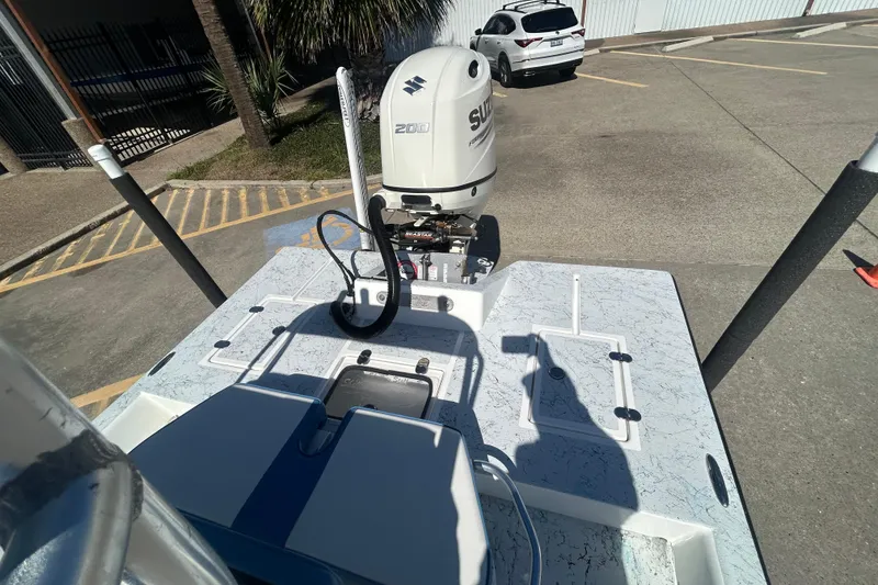Slide: The Image of 2021 Shallow Stalker CAT-204 Pro boat with Suzuki outboard motor in parking lot. - 7