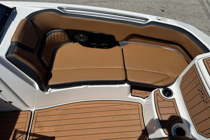 Slide: The Image of Luxurious seating on 2026 Yamaha Boats 252SD, featuring tan upholstery and sleek design. - 15