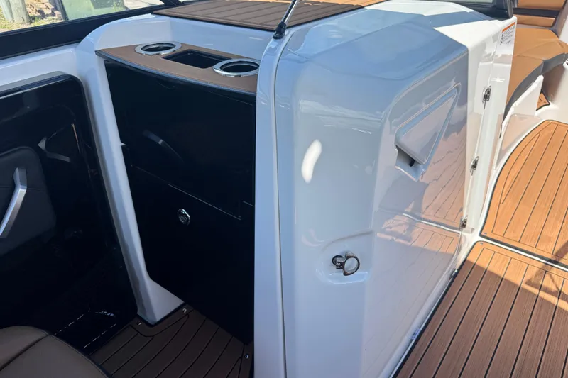 Slide: The Image of 2026 Yamaha Boats 252SD interior with sleek design and wood accents. - 17