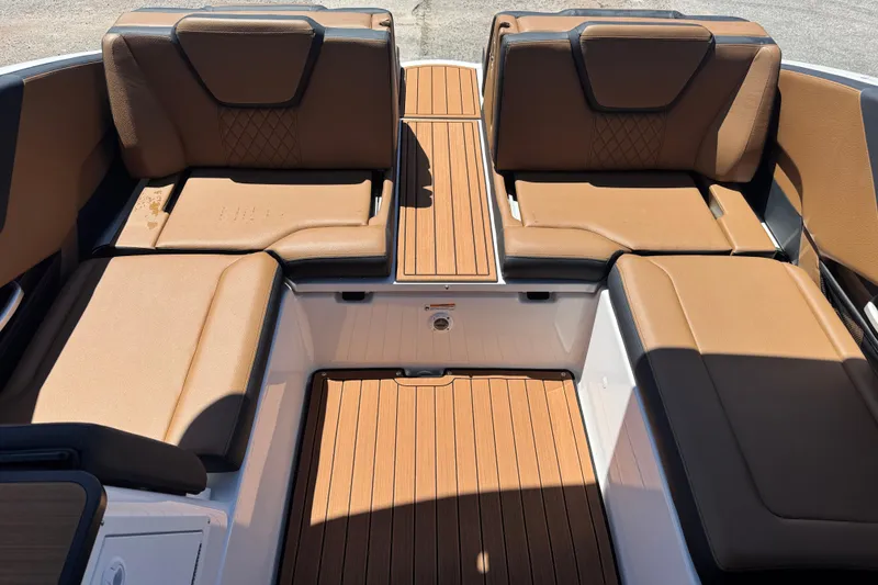 Slide: The Image of 2026 Yamaha Boats 252SD interior with tan seating and wood-style flooring. - 21