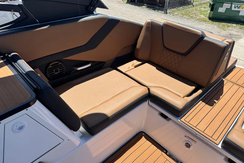 Slide: The Image of 2026 Yamaha Boats 252SD interior with luxurious brown seating and sleek design. - 22