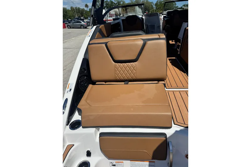 Slide: The Image of 2026 Yamaha Boats 252SD interior with tan leather seating and wood-style flooring. - 7