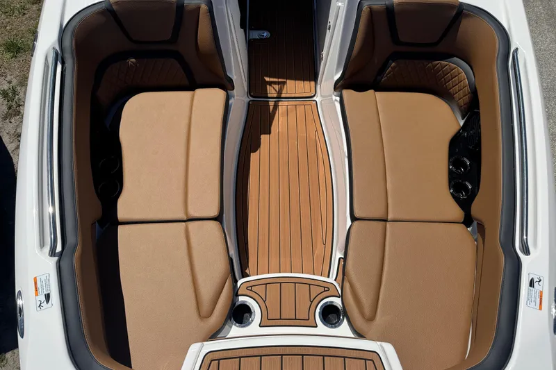 Slide: The Image of 2026 Yamaha Boats 252SD interior with tan seating and wood-style flooring. - 12