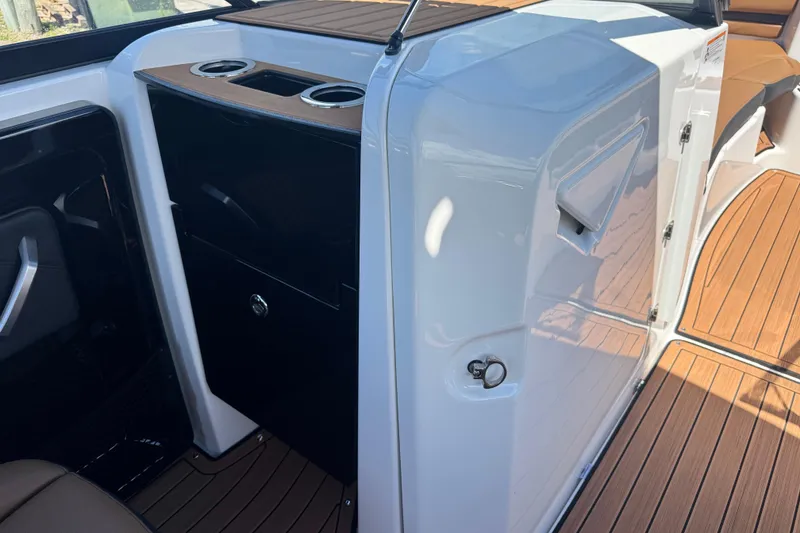 Slide: The Image of 2026 Yamaha Boats 252SD interior with sleek design and wood accents. - 16
