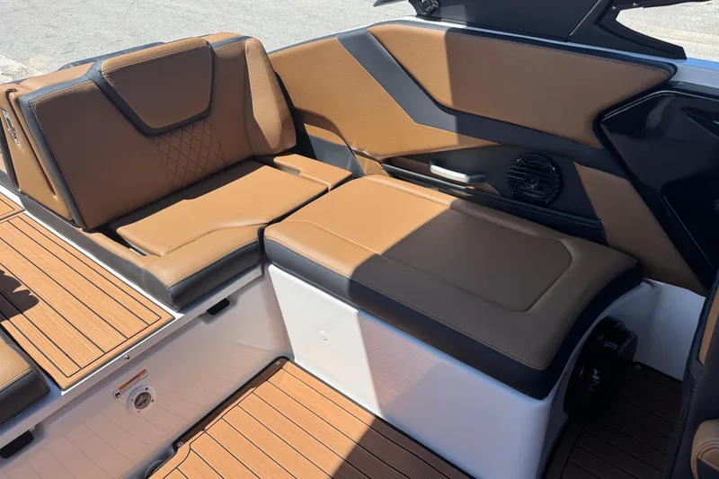 Slide: The Image of Luxurious seating on 2026 Yamaha Boats 252SD, featuring brown upholstery and sleek design. - 19