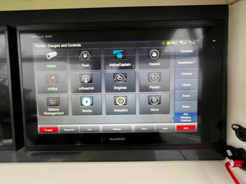 Slide: The Image of Garmin GPS display on 2011 Fountain 38 CC Tournament Edition boat, showing various control options. - 18