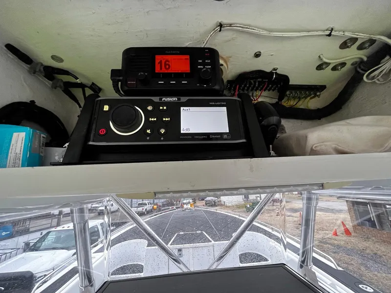 Slide: The Image of 2011 Fountain 38 CC Tournament Edition boat dashboard with navigation and communication equipment. - 21
