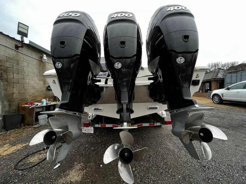 Slide: The Image of Triple outboard motors on a 2011 Fountain 38 CC Tournament Edition boat. - 30