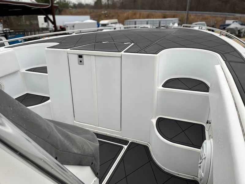 Slide: The Image of 2011 Fountain 38 CC Tournament Edition boat interior with sleek seating and storage compartments. - 8