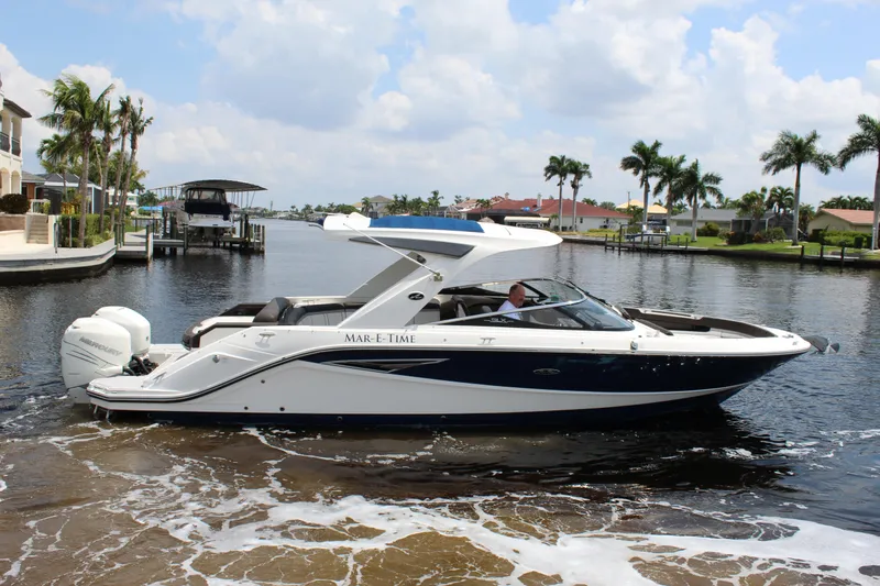 The Image of 2017 Sea Ray SLX 310 boat on water in sunny weather. - 0