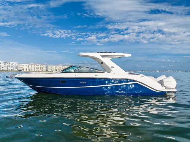 Slide: The Image of 2017 Sea Ray SLX 310 boat with luxurious rear seating area. - 10