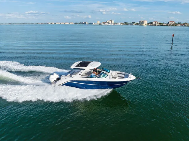 Slide: The Image of Luxurious seating area on a 2017 Sea Ray SLX 310 yacht. - 7