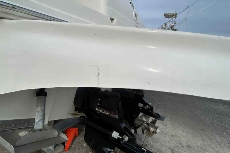 Slide: The Image of 2006 Sea Ray 300 Sundancer with visible hull crack and MerCruiser outdrive. - 4
