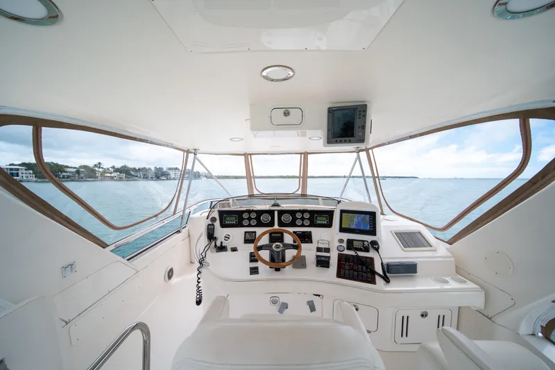 Slide: The Image of Interior view of 2003 Sea Ray 480 Sedan Bridge yacht cockpit with navigation equipment. - 10