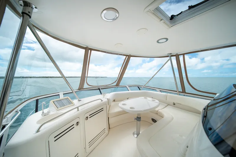 Slide: The Image of Luxurious interior of 2003 Sea Ray 480 Sedan Bridge yacht with ocean view. - 17
