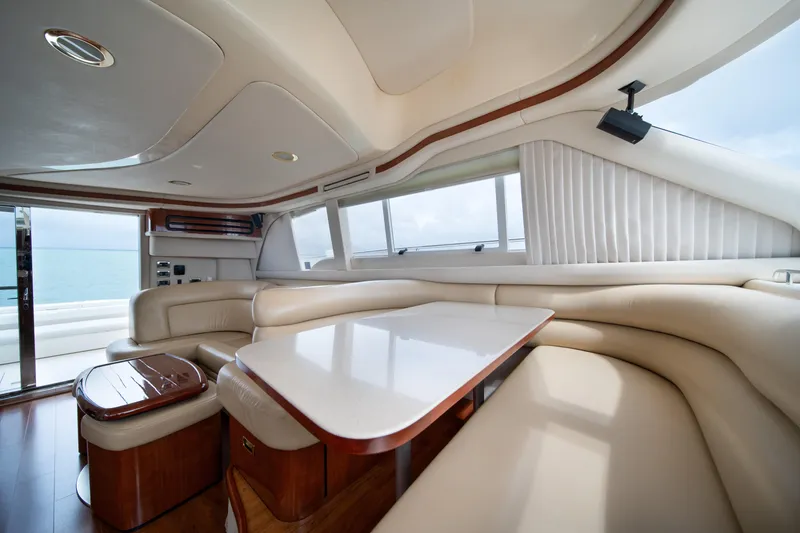 Slide: The Image of Luxurious interior of 2003 Sea Ray 480 Sedan Bridge yacht with plush seating and elegant design. - 18